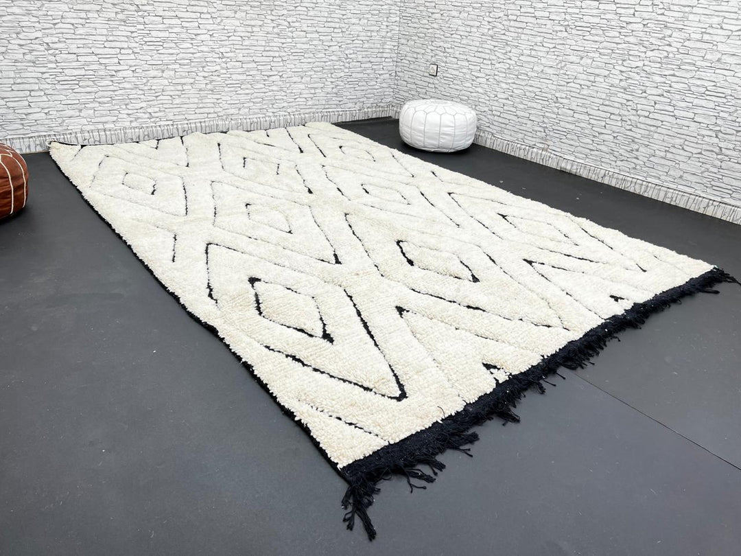 Ivory Moroccan wool rug with black diamond lattice handmade by Berber artisans