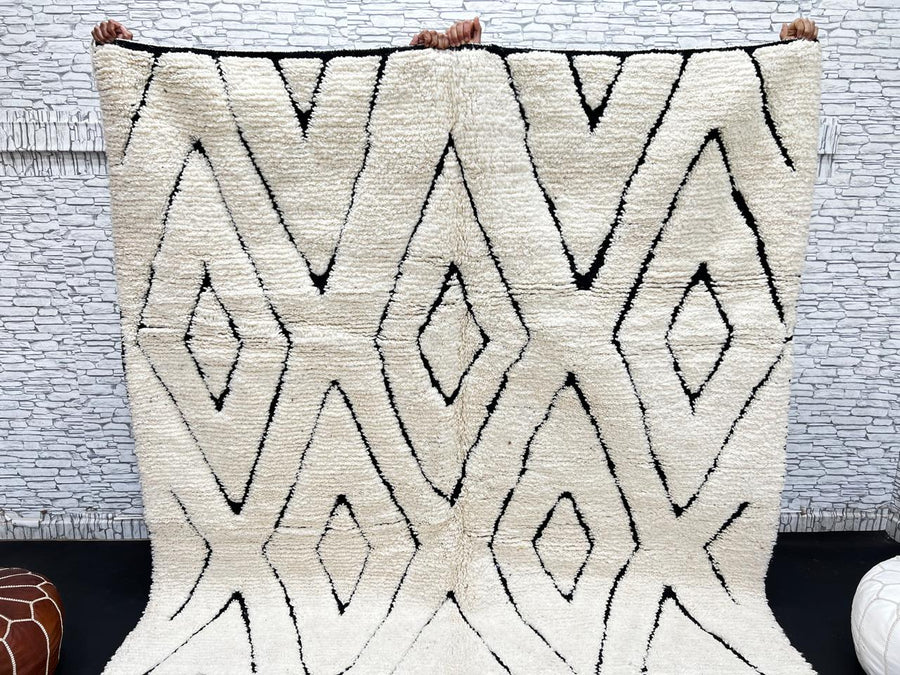 Ivory Moroccan wool rug with black diamond lattice handmade by Berber artisans