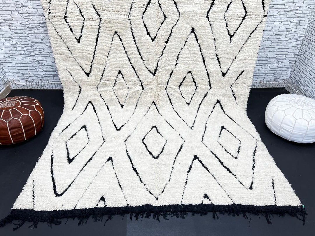 Ivory Moroccan wool rug with black diamond lattice handmade by Berber artisans