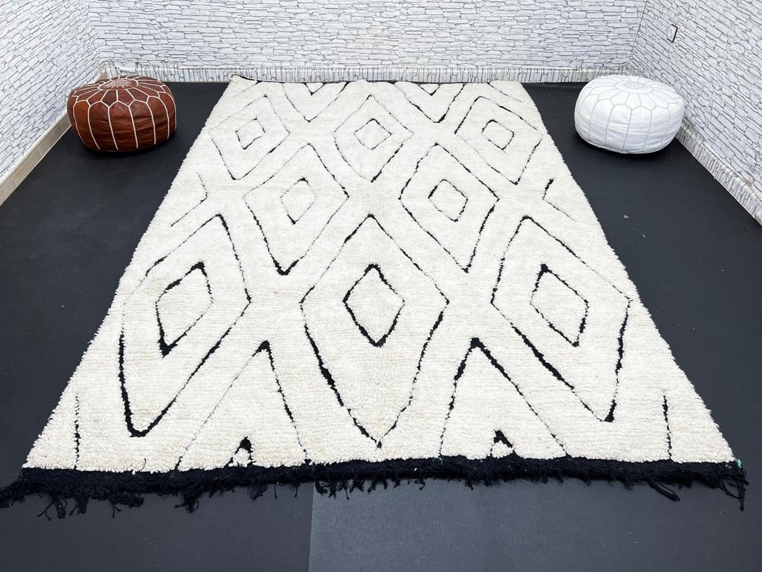 Ivory Moroccan wool rug with black diamond lattice handmade by Berber artisans