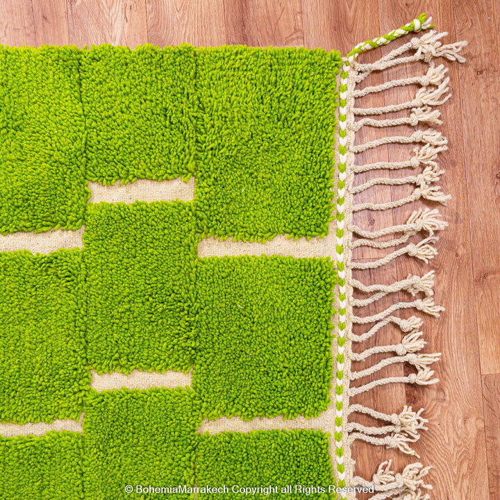 Handmade Moroccan rug in green checkered brick design, crafted from soft wool by Berber artisans
