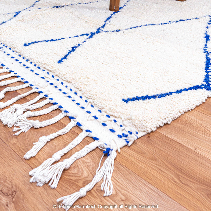 Large Beni Ourain Moroccan wool rug with blue diamond pattern on white background – handmade by Berber artisans