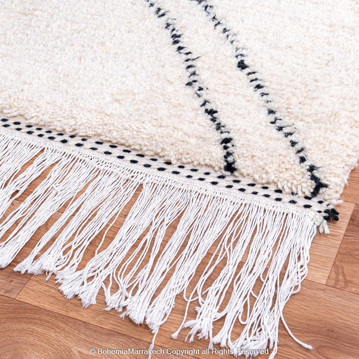Minimalist Moroccan Beni Ourain rug in black and white wool with hand-knotted tribal motifs