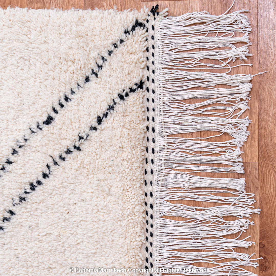 Minimalist Moroccan Beni Ourain rug in black and white wool with hand-knotted tribal motifs