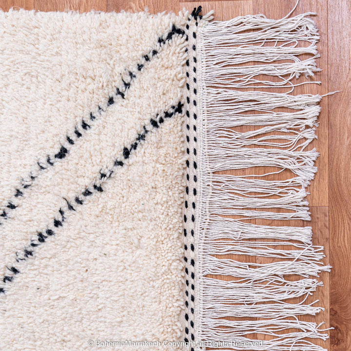 Minimalist Moroccan Beni Ourain rug in black and white wool with hand-knotted tribal motifs