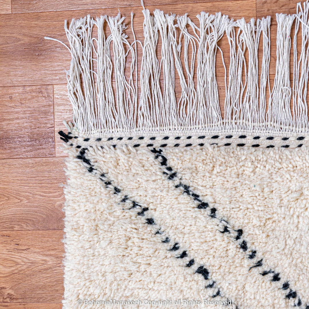 Minimalist Moroccan Beni Ourain rug in black and white wool with hand-knotted tribal motifs
