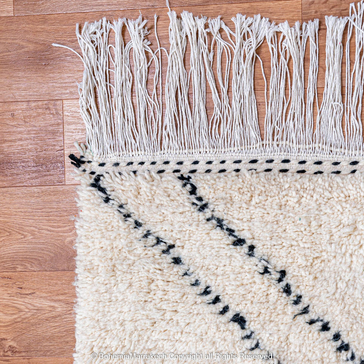 Minimalist Moroccan Beni Ourain rug in black and white wool with hand-knotted tribal motifs
