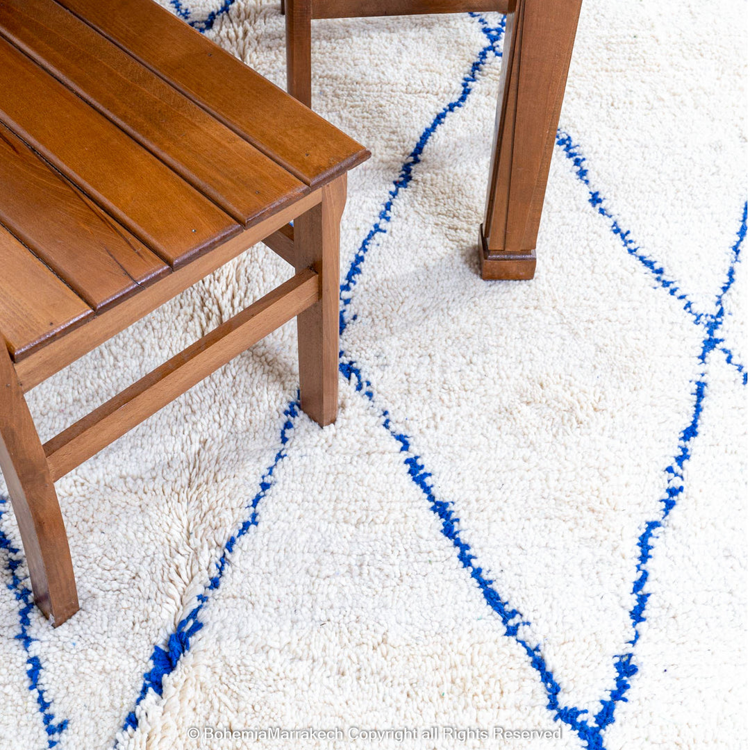 Large Beni Ourain Moroccan wool rug with blue diamond pattern on white background – handmade by Berber artisans
