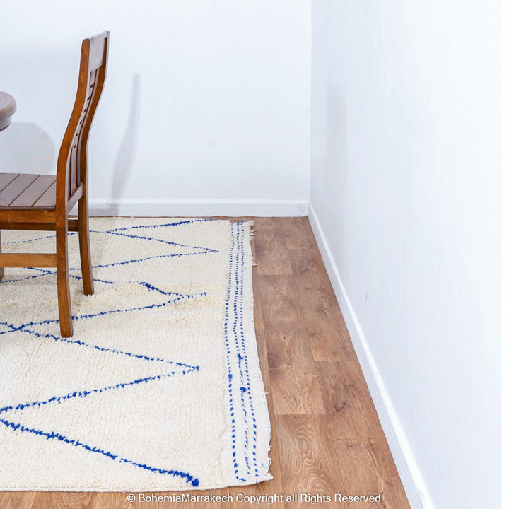 Large Beni Ourain Moroccan wool rug with blue diamond pattern on white background – handmade by Berber artisans