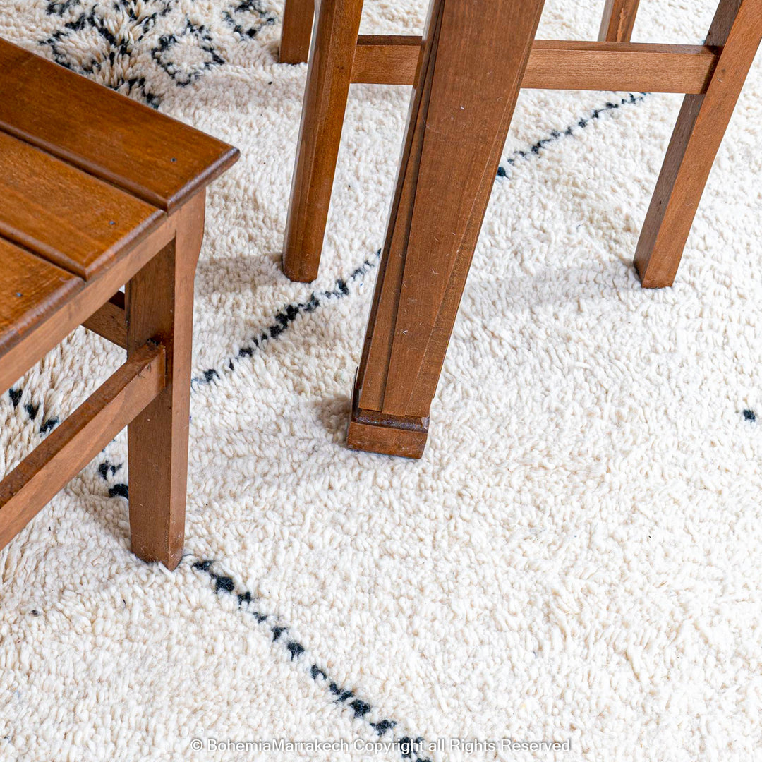 Minimalist Moroccan Beni Ourain rug in black and white wool with hand-knotted tribal motifs