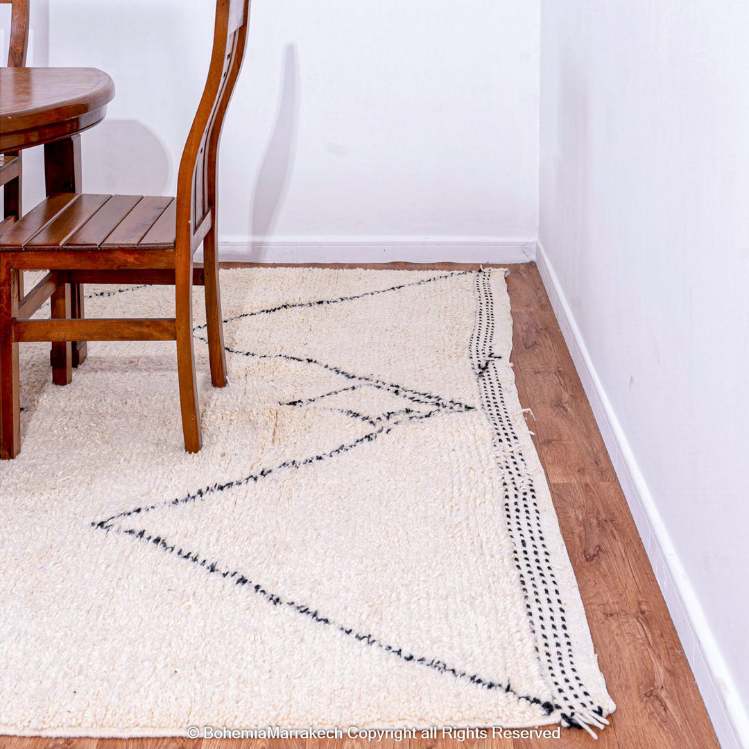 Minimalist Moroccan Beni Ourain rug in black and white wool with hand-knotted tribal motifs
