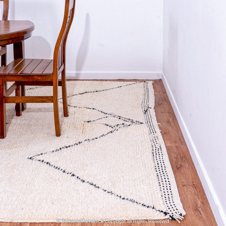 Minimalist Moroccan Beni Ourain rug in black and white wool with hand-knotted tribal motifs