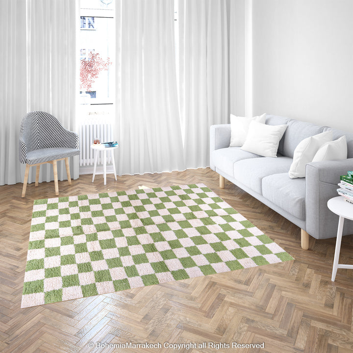 Green and white checkered Moroccan wool rug decorating a modern living room, showcasing handmade Berber design. Available for sale.