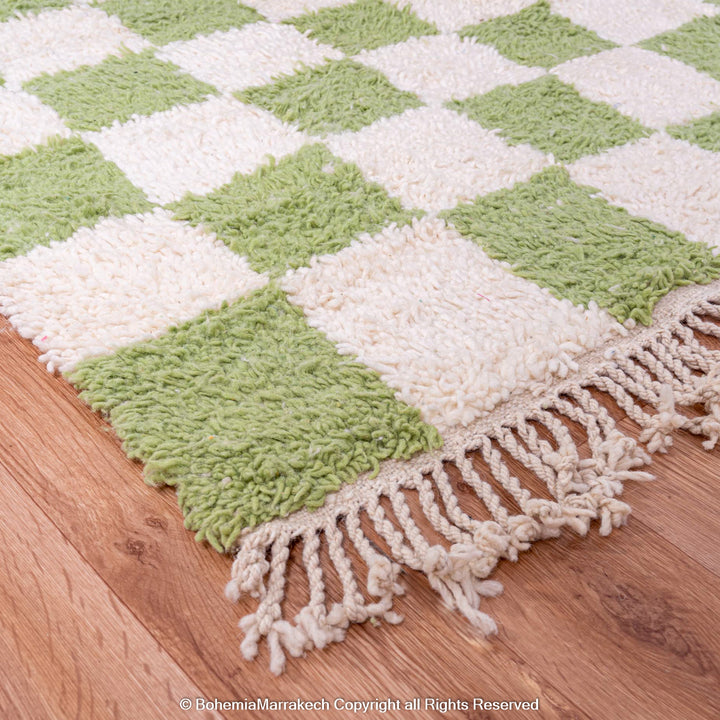 Green and white checkered Moroccan Berber wool rug with fringe, handmade, adds vintage charm and modern style to any space.