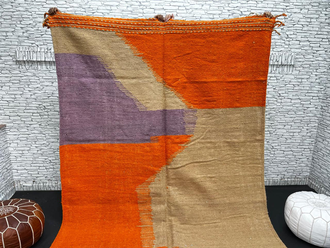 Handwoven Moroccan wool rug in light brown, orange, and purple with geometric modern pattern – natural flatweave Berber carpet