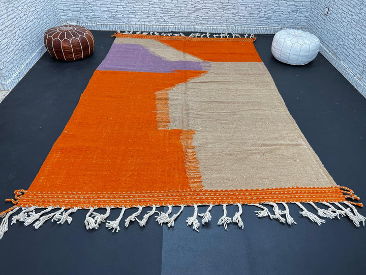 Handwoven Moroccan wool rug in light brown, orange, and purple with geometric modern pattern – natural flatweave Berber carpet