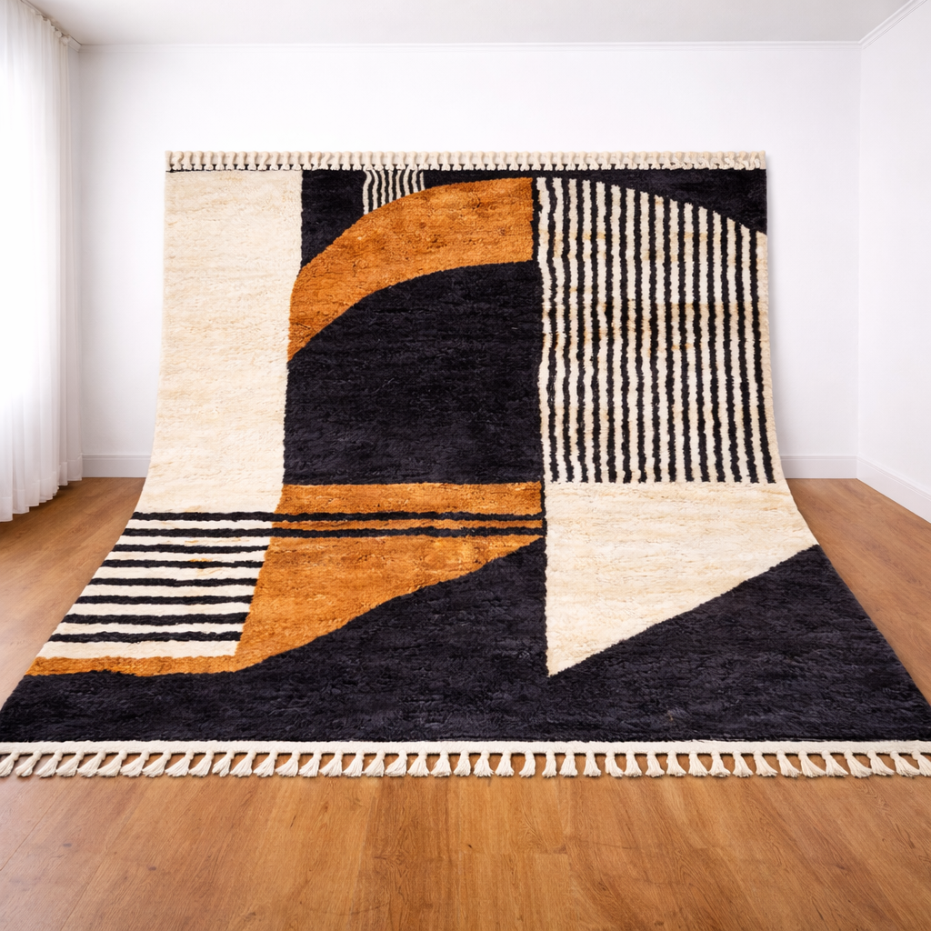 Geometric patterned rug on a wooden floor with white walls