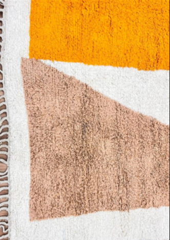 Luxury modern Moroccan wool rug with abstract ochre beige and charcoal color blocks on a cream white background