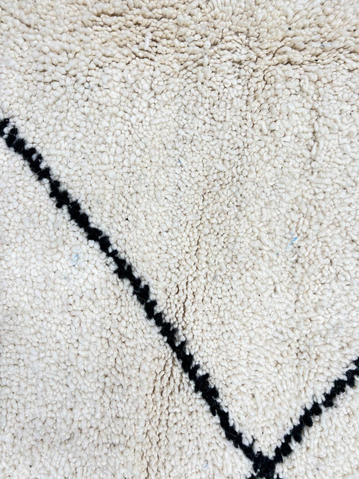 Minimalist Beni Ourain Moroccan wool rug with black diamond pattern