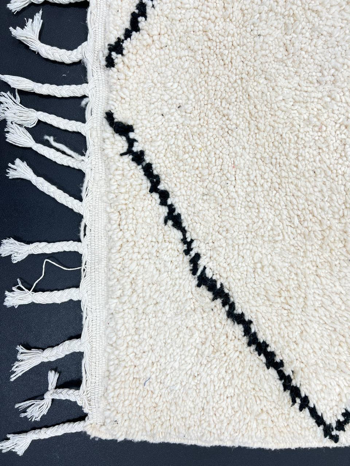Minimalist Beni Ourain Moroccan wool rug with black diamond pattern