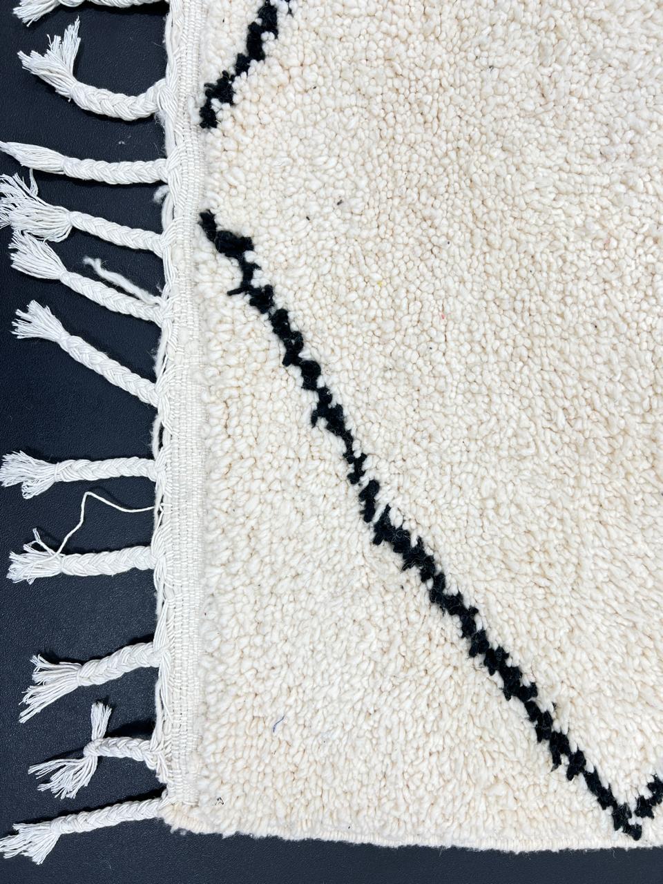 Minimalist Beni Ourain Moroccan wool rug with black diamond pattern