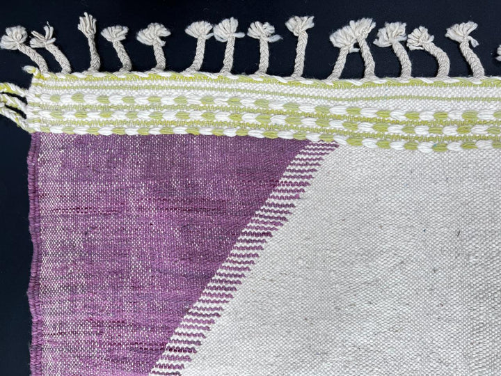 Handmade Moroccan kilim runner rug with green and purple geometric design on white background, flatwoven minimalist Moroccan corridor rug