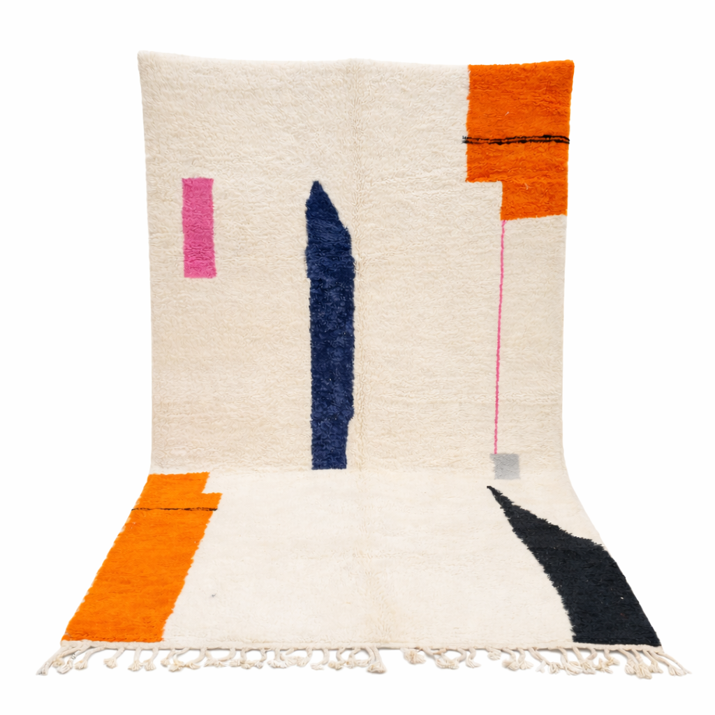 Minimalist Moroccan wool rug with abstract navy, orange and pink line design on cream background