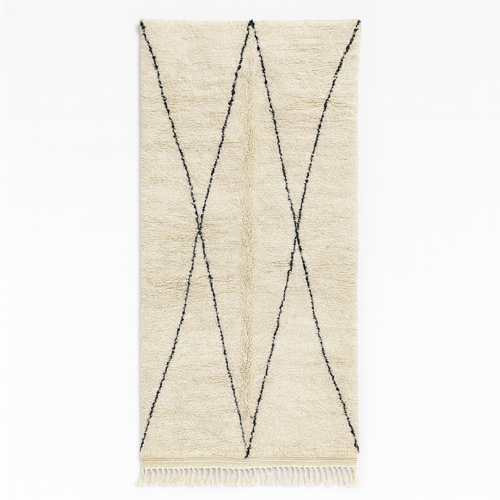 Handmade white Moroccan runner rug with minimalist black geometric line pattern in soft natural wool.