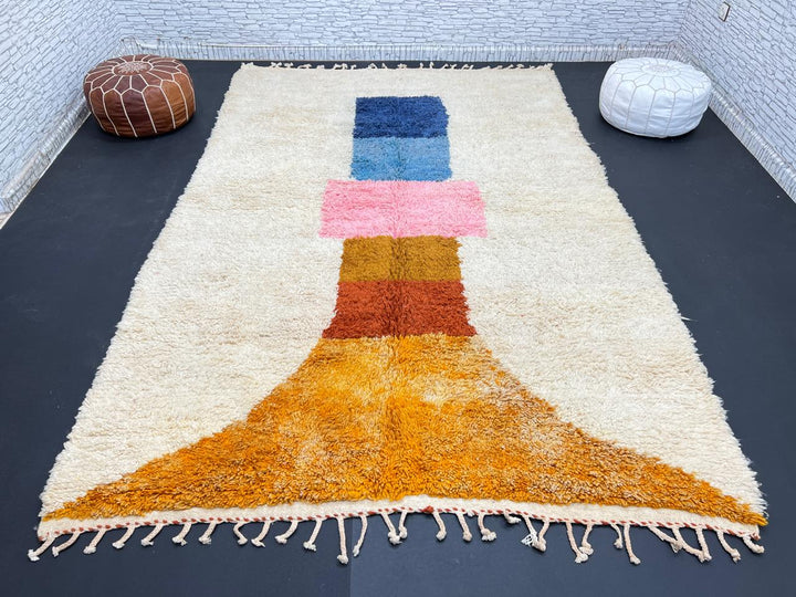 Handmade Moroccan wool rug with modern abstract geometric design in navy, teal, pink, orange, and mustard tones