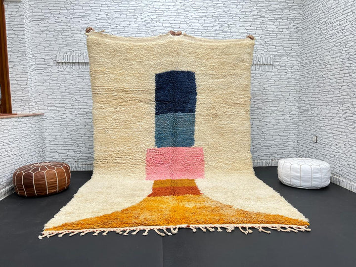 Handmade Moroccan wool rug with modern abstract geometric design in navy, teal, pink, orange, and mustard tones