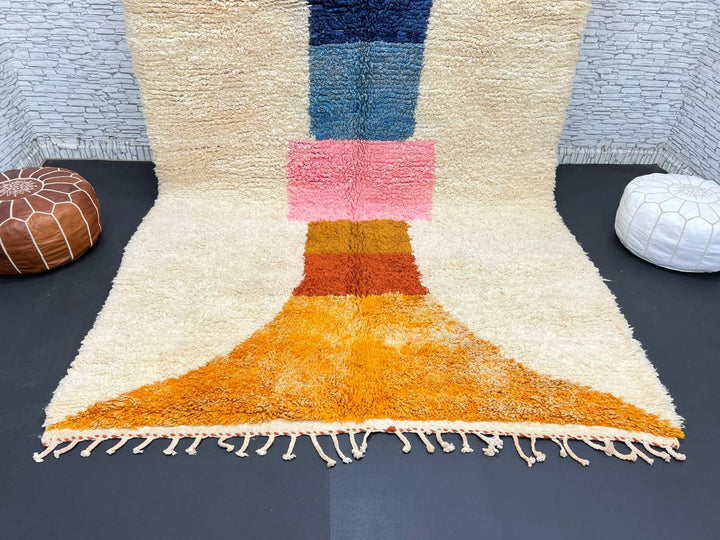 Handmade Moroccan wool rug with modern abstract geometric design in navy, teal, pink, orange, and mustard tones
