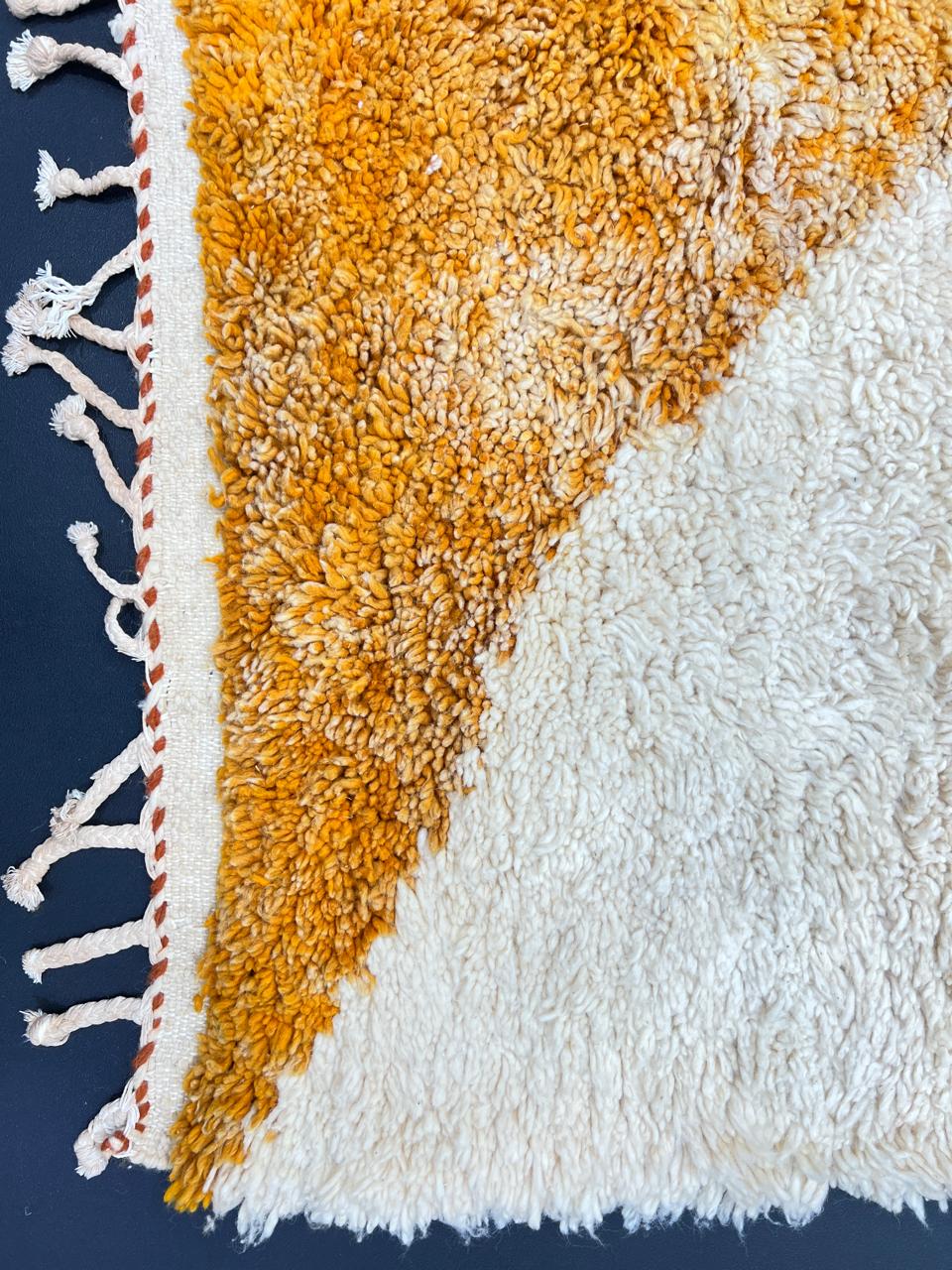 Handmade Moroccan wool rug with modern abstract geometric design in navy, teal, pink, orange, and mustard tones