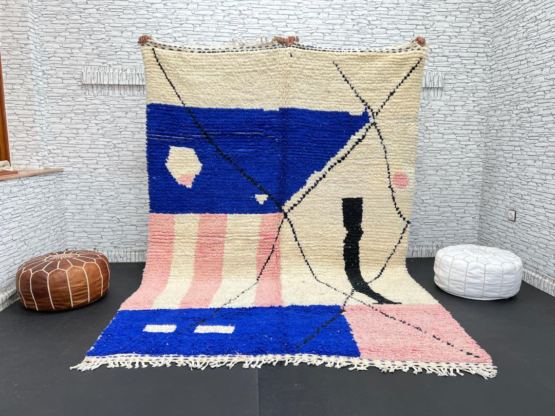 Handmade modern Moroccan wool rug with blue, pink, ivory, and black geometric abstract design