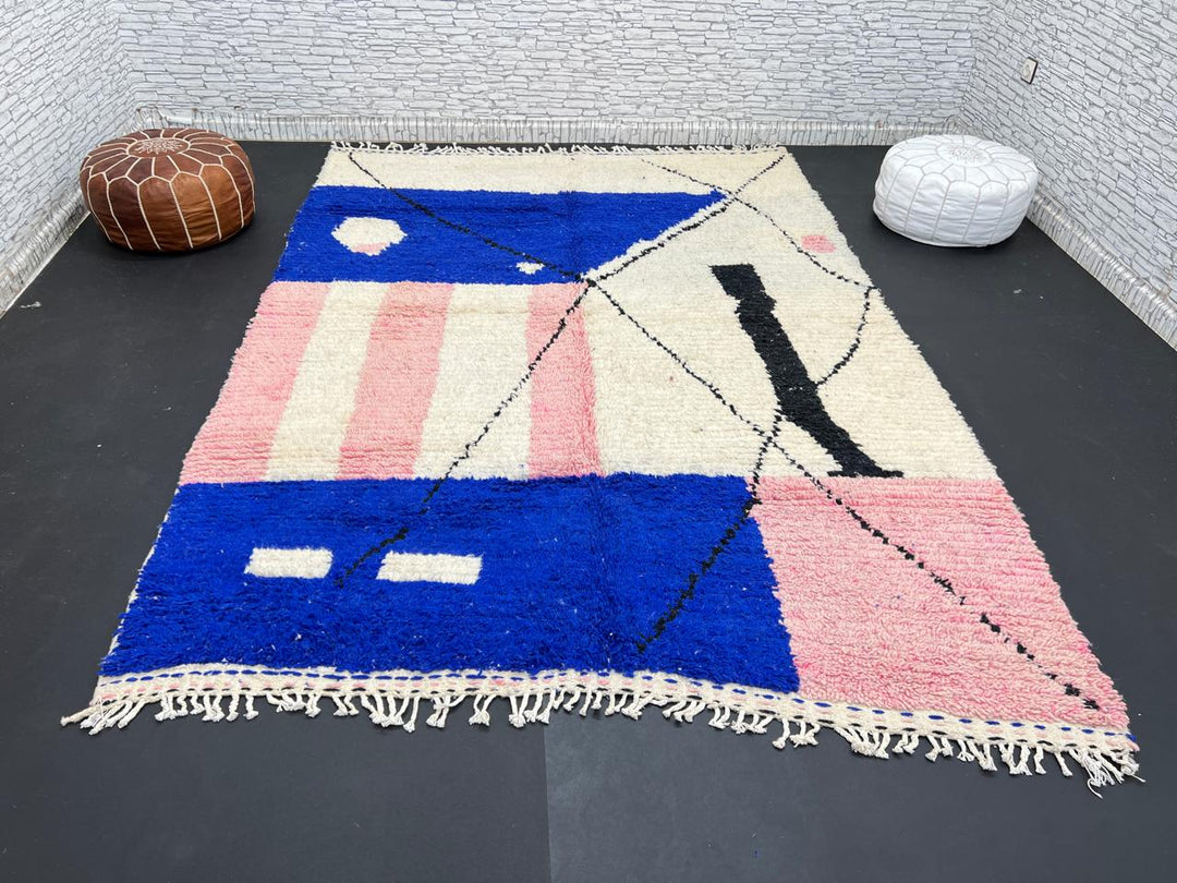 Handmade modern Moroccan wool rug with blue, pink, ivory, and black geometric abstract design