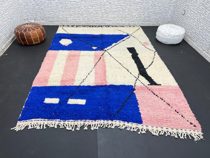 Handmade modern Moroccan wool rug with blue, pink, ivory, and black geometric abstract design