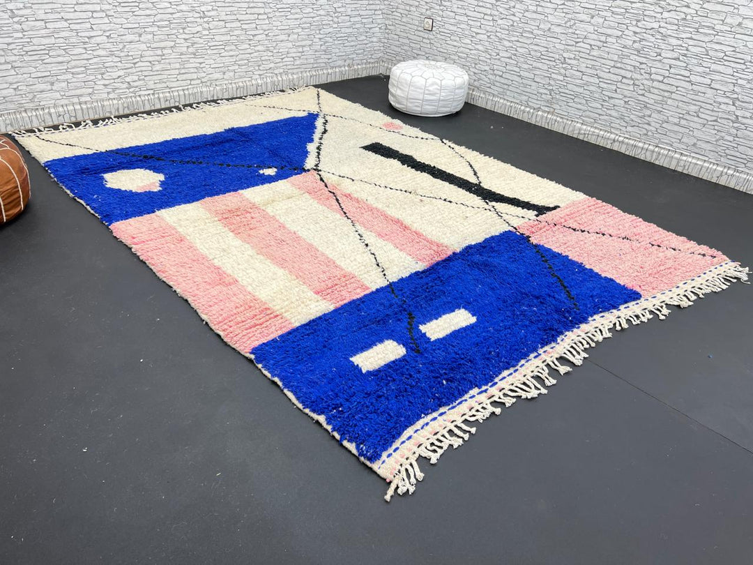 Handmade modern Moroccan wool rug with blue, pink, ivory, and black geometric abstract design