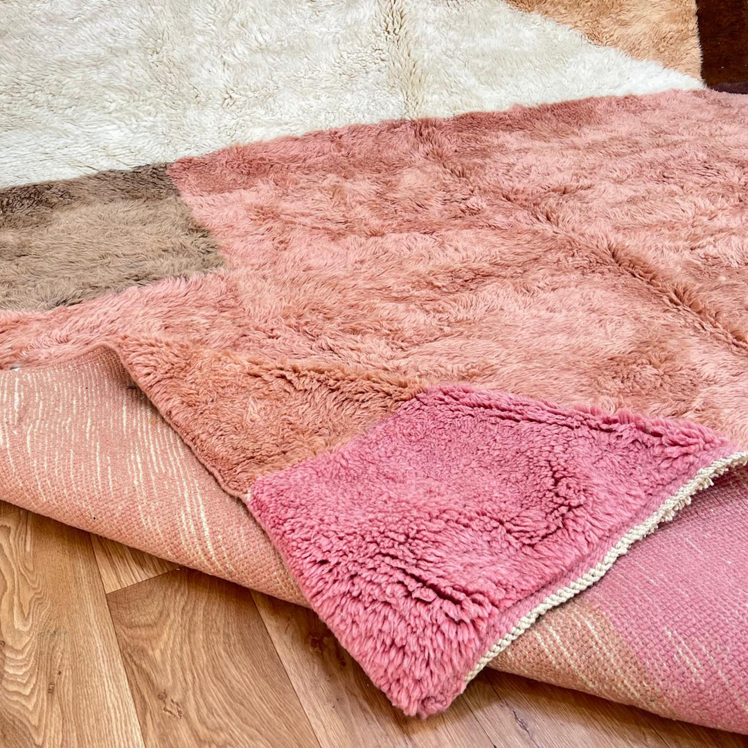 Handmade Moroccan wool rug with pink, cream and terracotta color-block design. Plush, soft texture crafted by artisans.