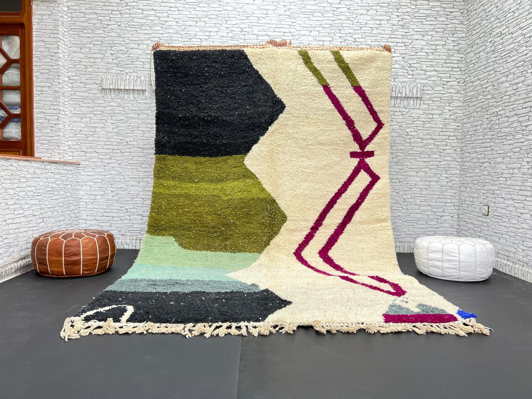 Handwoven Moroccan wool rug with abstract modern design in green, black, and magenta