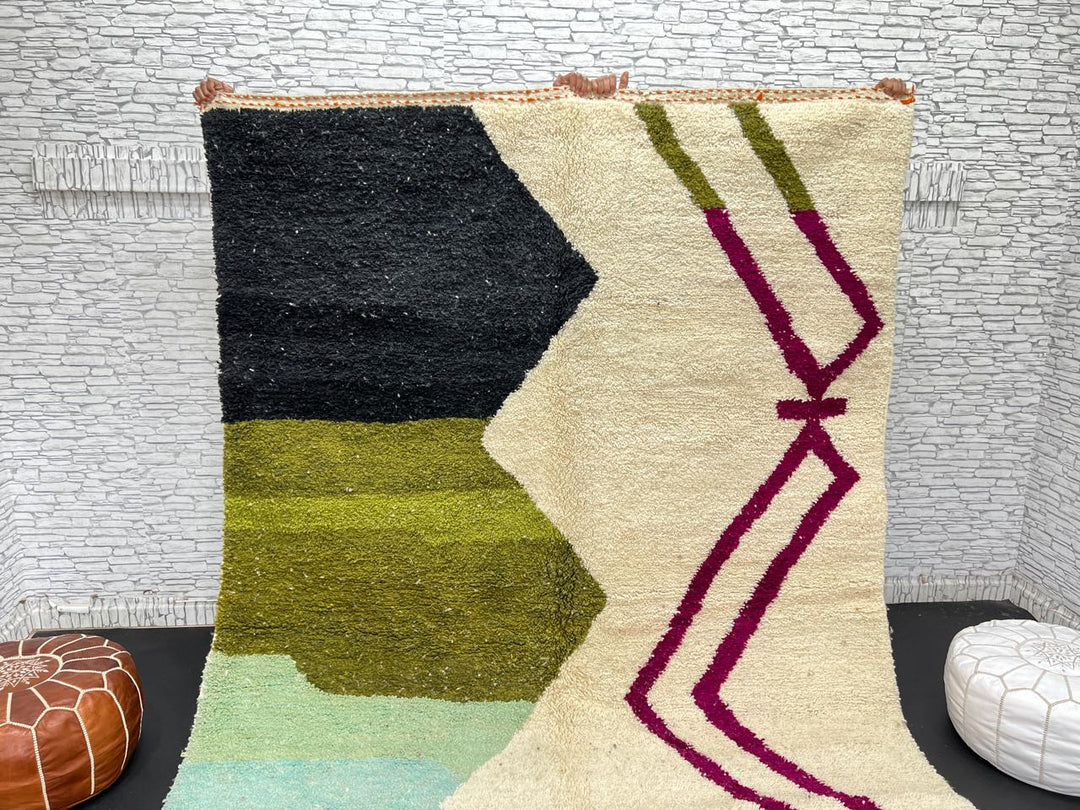 Handwoven Moroccan wool rug with abstract modern design in green, black, and magenta