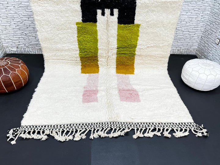 Modern abstract Moroccan wool rug with geometric blocks in black, green, and ochre, handmade by Berber artisans