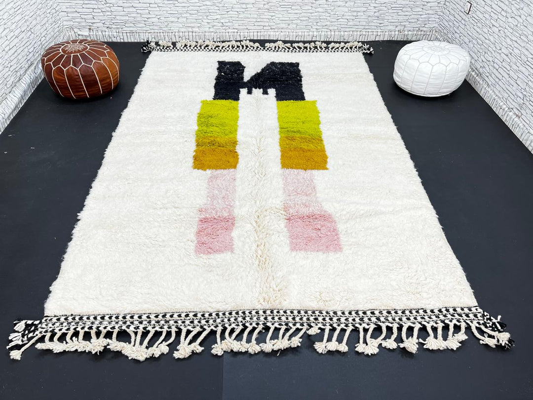 Modern abstract Moroccan wool rug with geometric blocks in black, green, and ochre, handmade by Berber artisans