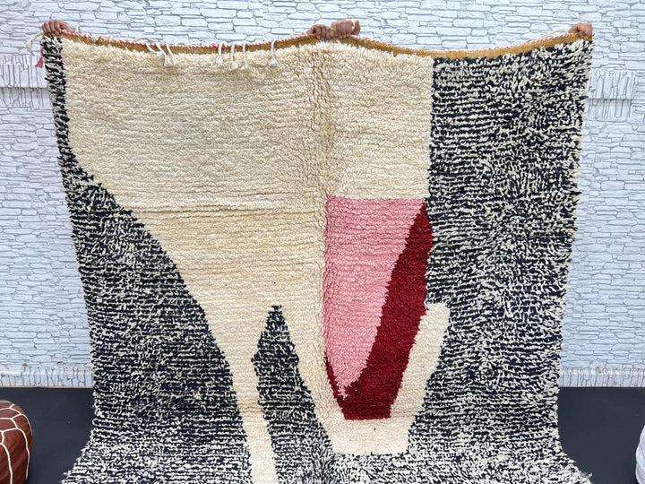 Handwoven Moroccan wool rug with abstract modern pattern in ivory, black, and red tones
