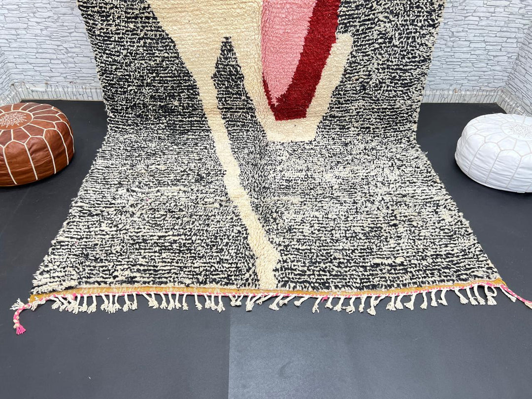 Handwoven Moroccan wool rug with abstract modern pattern in ivory, black, and red tones