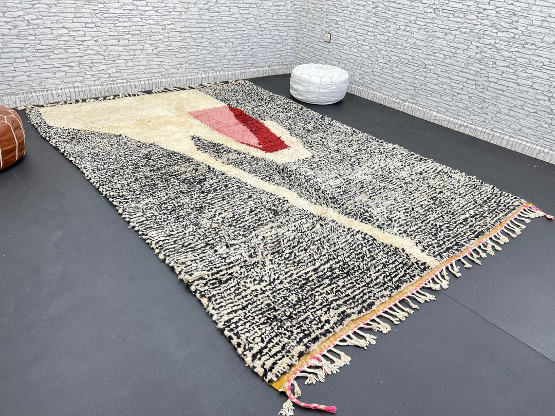 Handwoven Moroccan wool rug with abstract modern pattern in ivory, black, and red tones