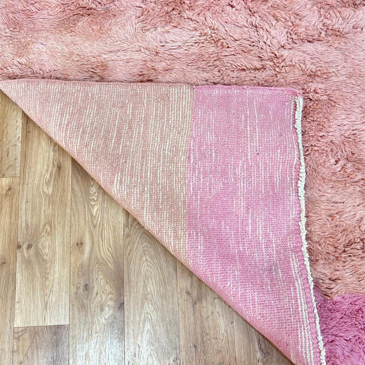 Handmade Moroccan wool rug with pink, cream and terracotta color-block design. Plush, soft texture crafted by artisans.