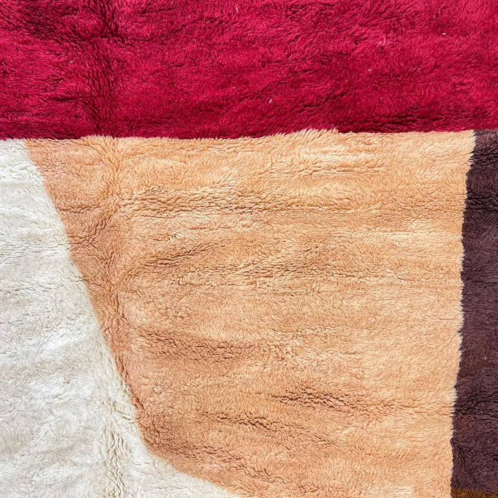 Handmade Moroccan wool rug with pink, cream and terracotta color-block design. Plush, soft texture crafted by artisans.