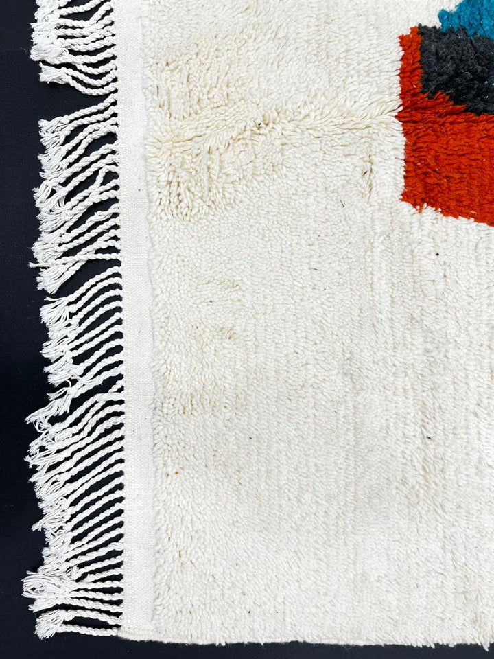 Handmade Moroccan runner rug with abstract color block design in black, teal blue and burnt orange on a white wool background, modern Berber style carpet runner for hallway or entryway