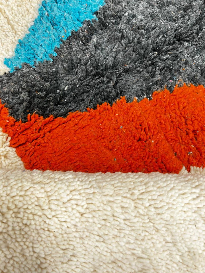 Handmade Moroccan runner rug with abstract color block design in black, teal blue and burnt orange on a white wool background, modern Berber style carpet runner for hallway or entryway
