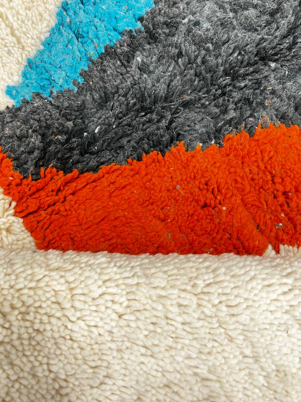 Handmade Moroccan runner rug with abstract color block design in black, teal blue and burnt orange on a white wool background, modern Berber style carpet runner for hallway or entryway