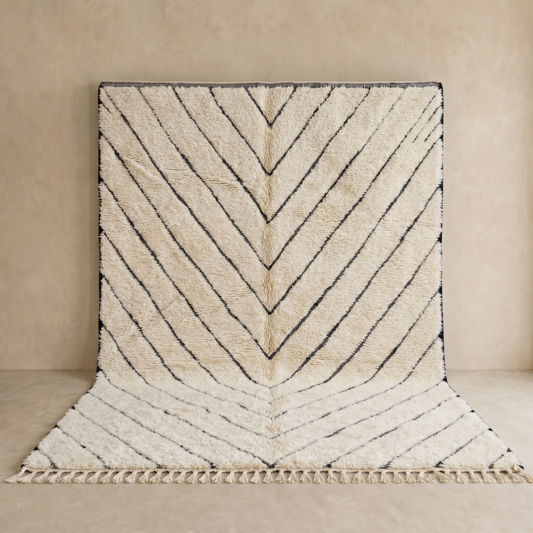 Modern Moroccan Beni Ourain wool rug with black chevron lines on cream background, handmade by Berber artisans